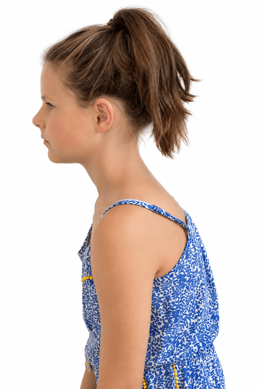 A child in profile, head carried forward of the shoulders and the upper back starting to round.